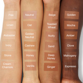 Clinique foundation bottle in hand to show true size and travel-friendly benefit