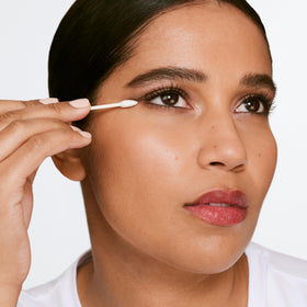 Clinique remover applied to cotton pad for quick makeup touch-ups and ease