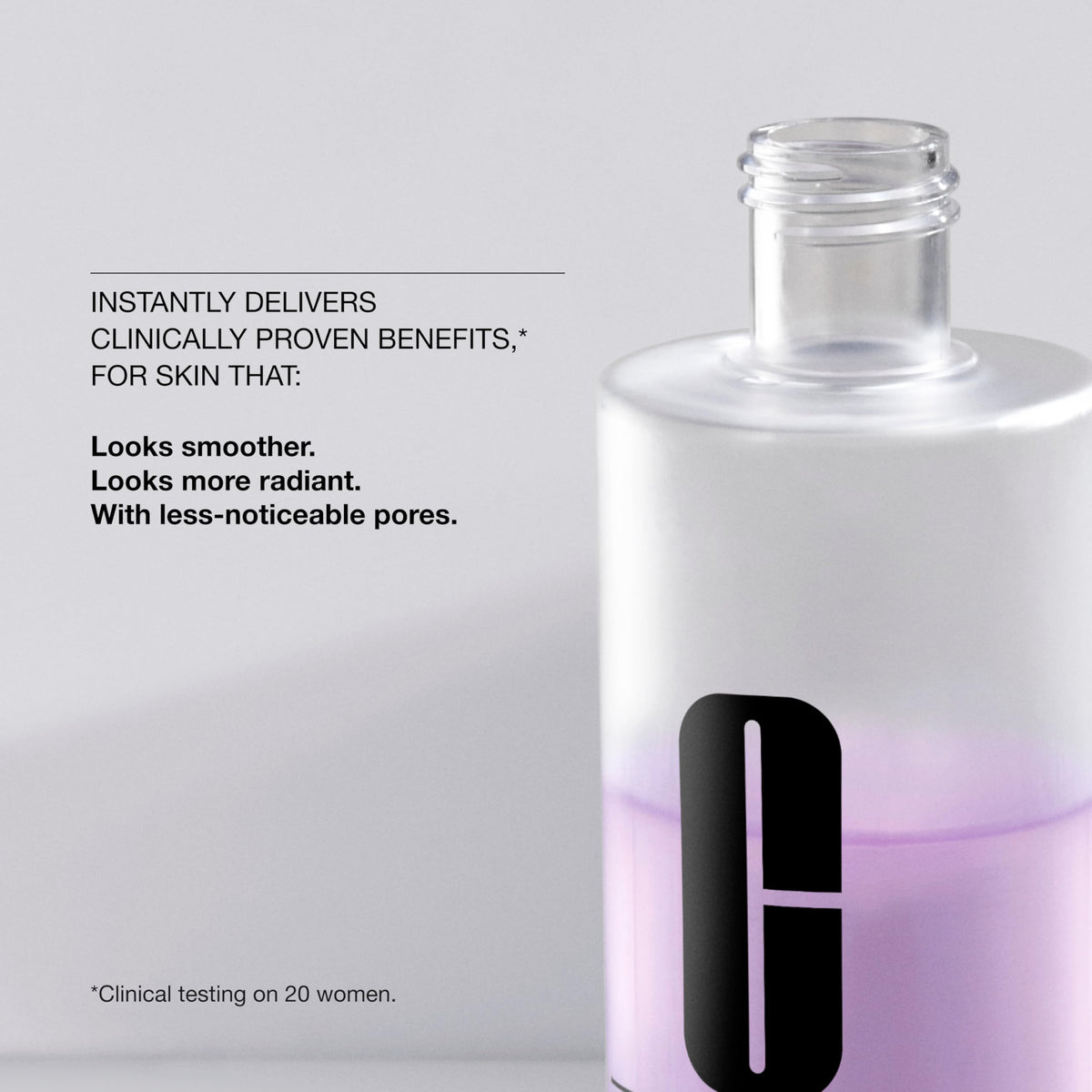 Clinique Clarifying Lotion 2 mini bottle next to a passport to show travel-friendly size and convenience