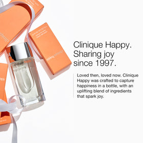 Clinique Happy bottle in a sunny lifestyle scene, conveys joyful wearability