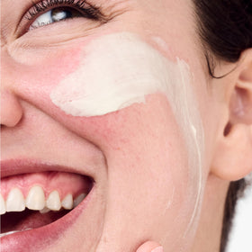 Clinique jar open displaying creamy formula and easy fingertip application