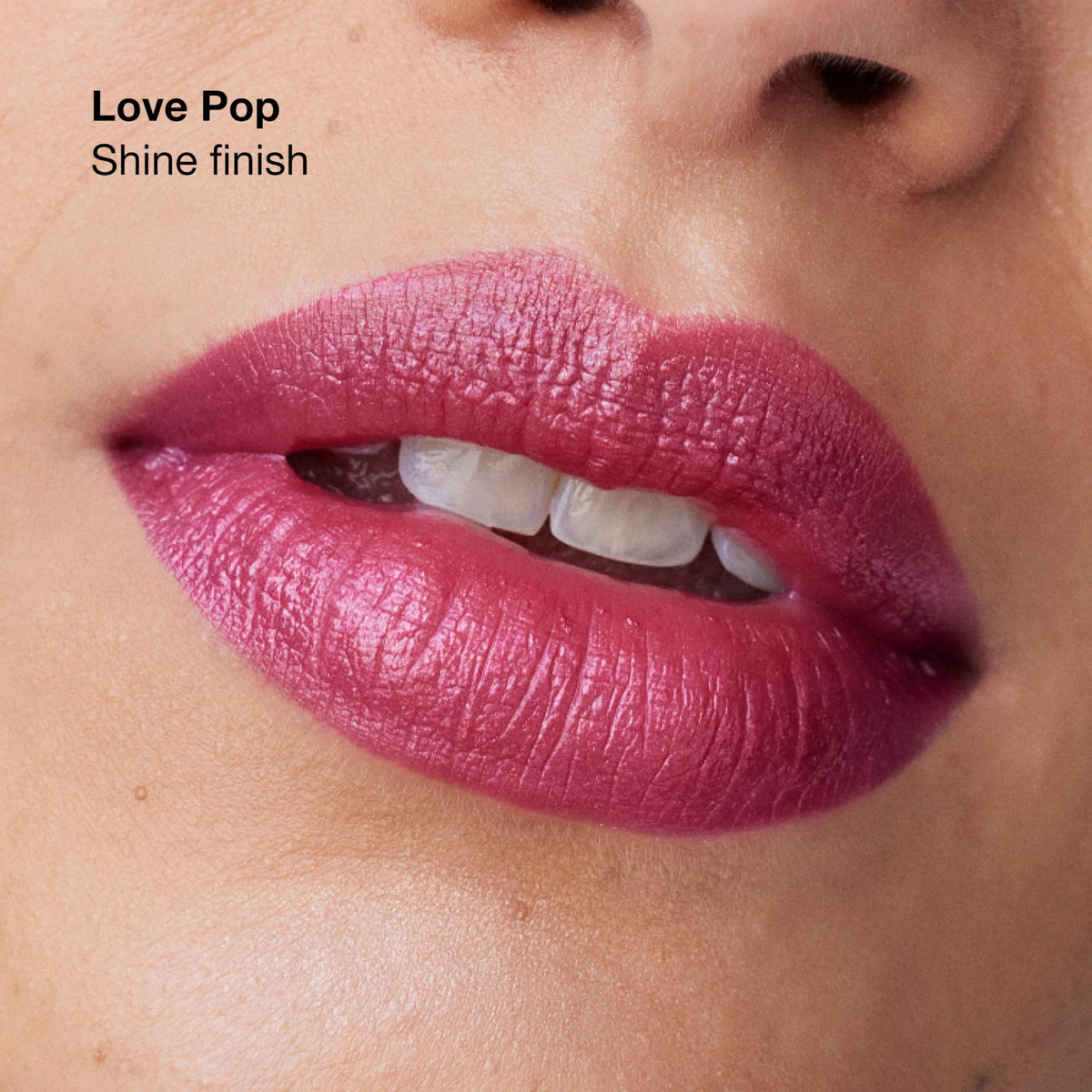 Clinique Pop applied on lips in satin finish showing even coverage and subtle sheen