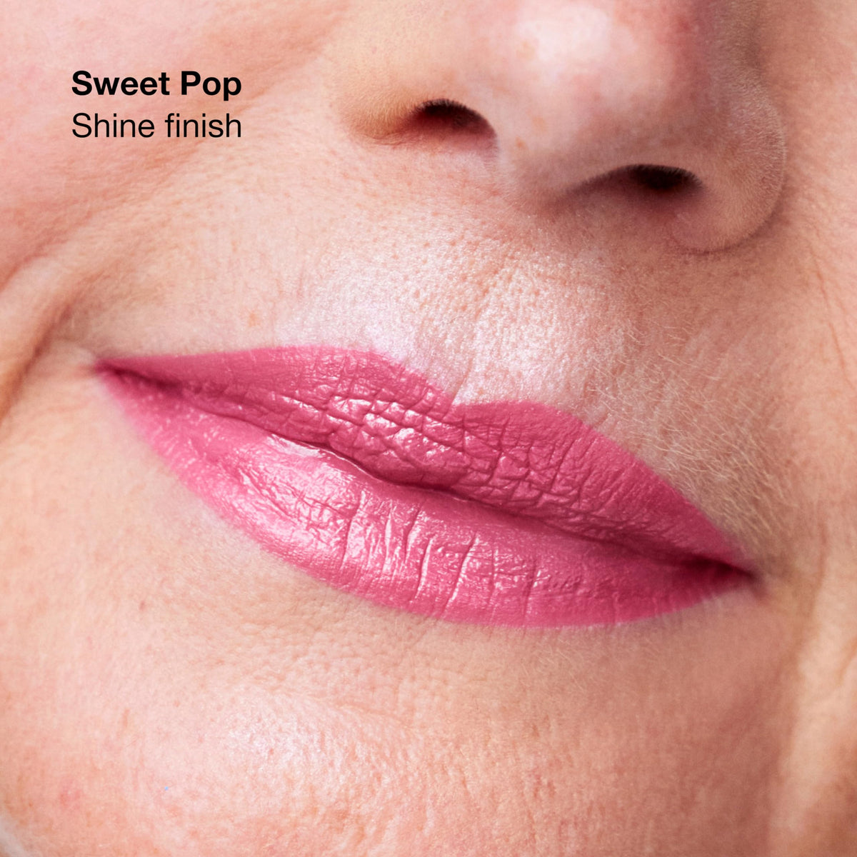 Clinique close-up of lipstick texture highlighting smooth primer-infused formula for even coverage