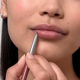 Clinique Quickliner paired with lipstick to show defined lip edges