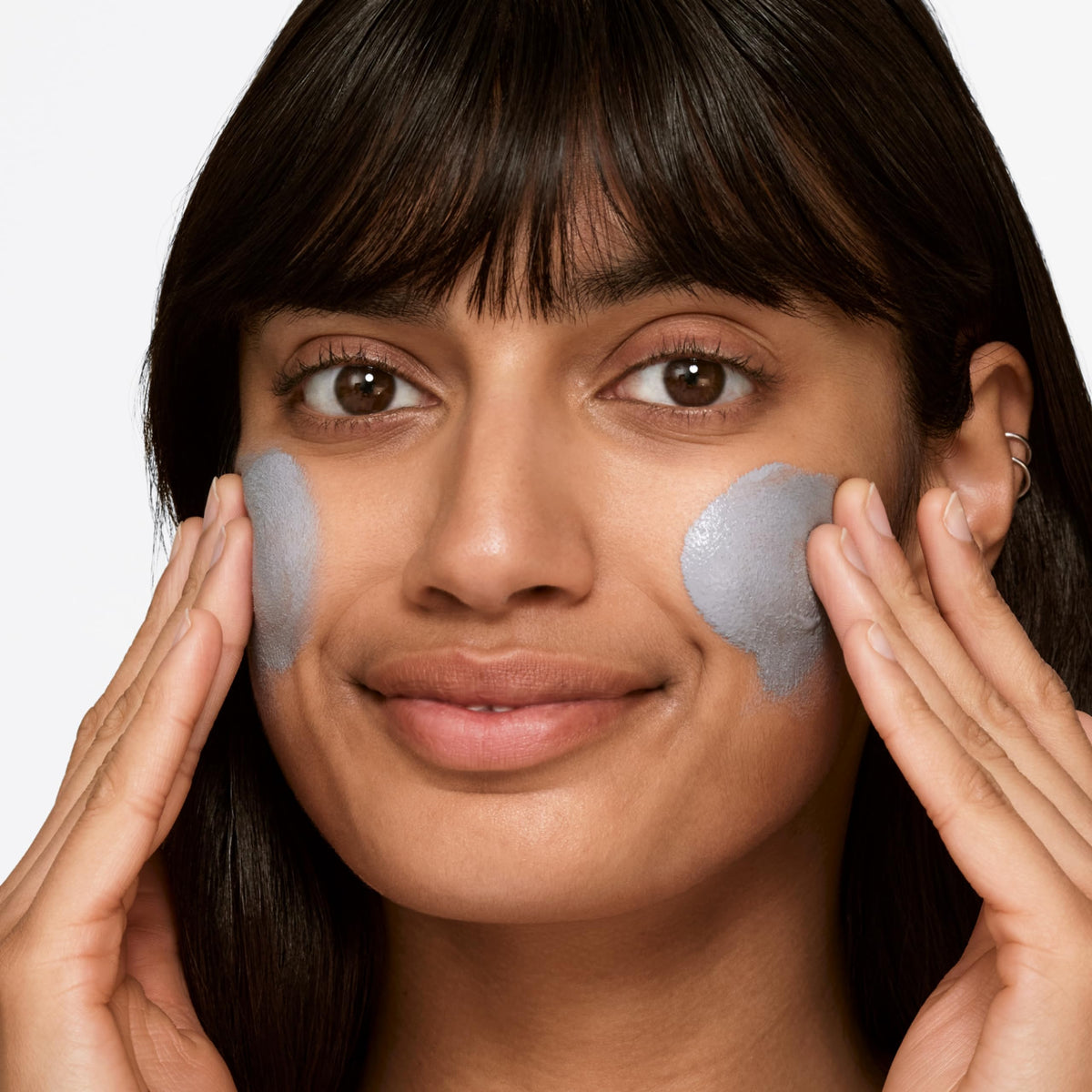 Clinique scrub being massaged on skin showing gentle exfoliation and instant smoothing benefit