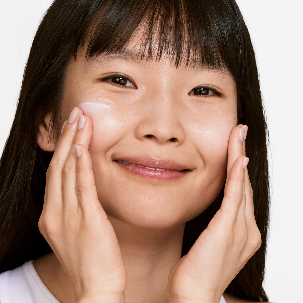 Clinique moisturizer applied to hand demonstrating non-greasy finish
