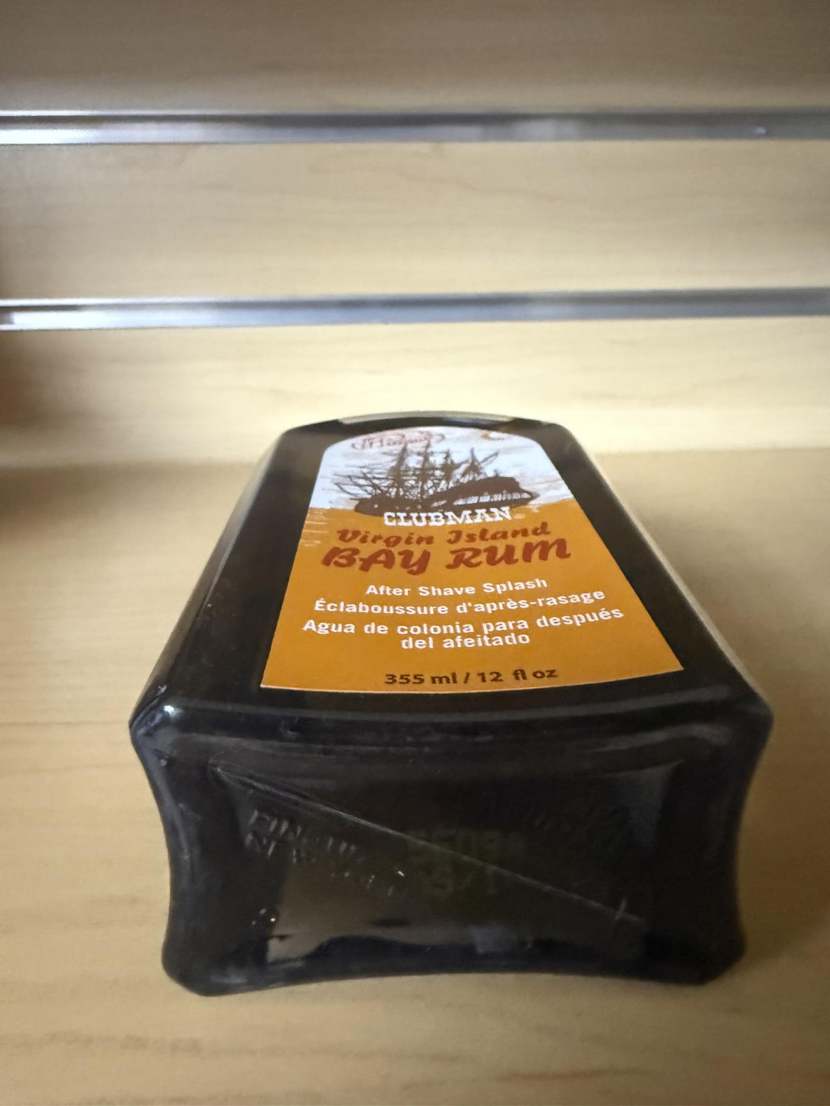 Clubman bottle staged with shaving brush and razor showing classic routine enhancement