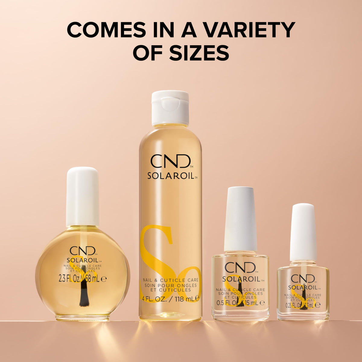Nail technician applying CND SolarOil over polish to show compatibility benefit