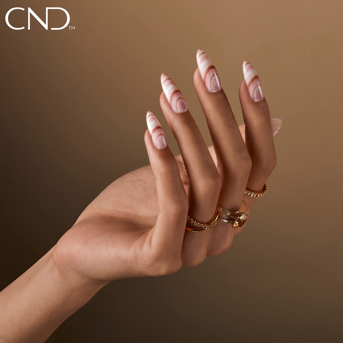 CND Vinylux shimmer detail macro revealing opalescent pink pearl and luminous glow