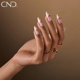 CND Vinylux shimmer detail macro revealing opalescent pink pearl and luminous glow