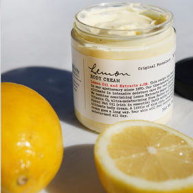 C. O. Bigelow jar next to hand illustrating true 8oz size and portability