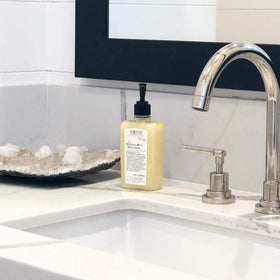 C. O. Bigelow bottle staged on sink in bathroom showing fresh citrus ambiance