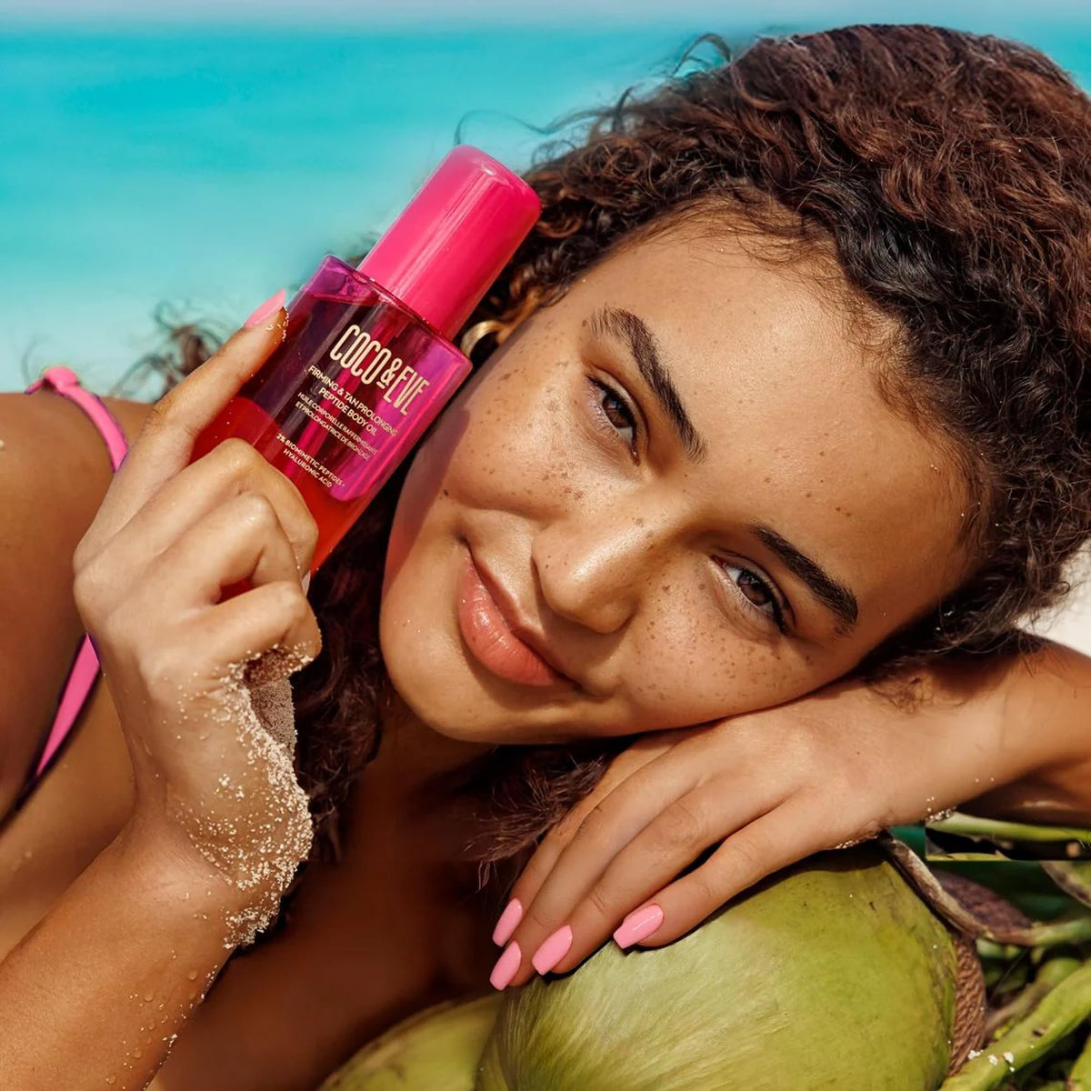 Coco & Eve lifestyle beach scene illustrating after-sun use and natural tan care