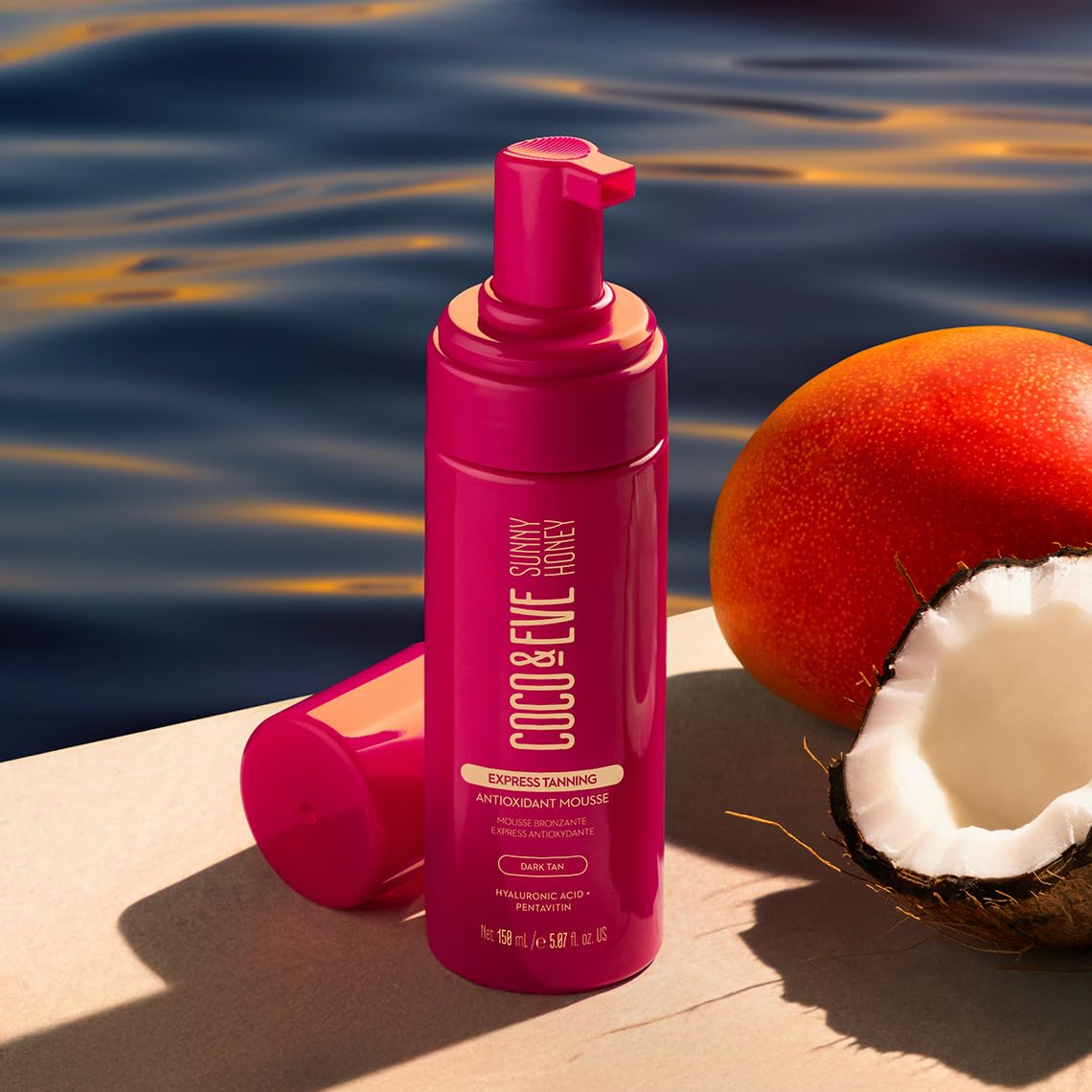 Coco & Eve in a beach bag lifestyle shot implying vacation-ready bronzed glow