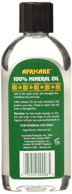 COCOCARE Africare oil being applied to hand, demonstrates moisture sealing benefit