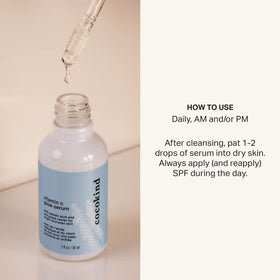 Cocokind bottle held by hand to show 1 fl oz scale and portability benefit