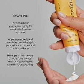Cocokind tube next to everyday items showing compact 1.7 fl oz size