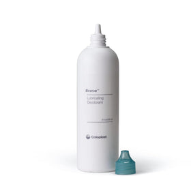 Coloplast Brava bottle in hand to show 8 oz scale and travel convenience