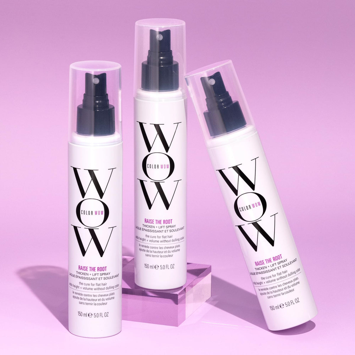 COLOR WOW bottle held next to a hand to show product size and travel-friendly benefit