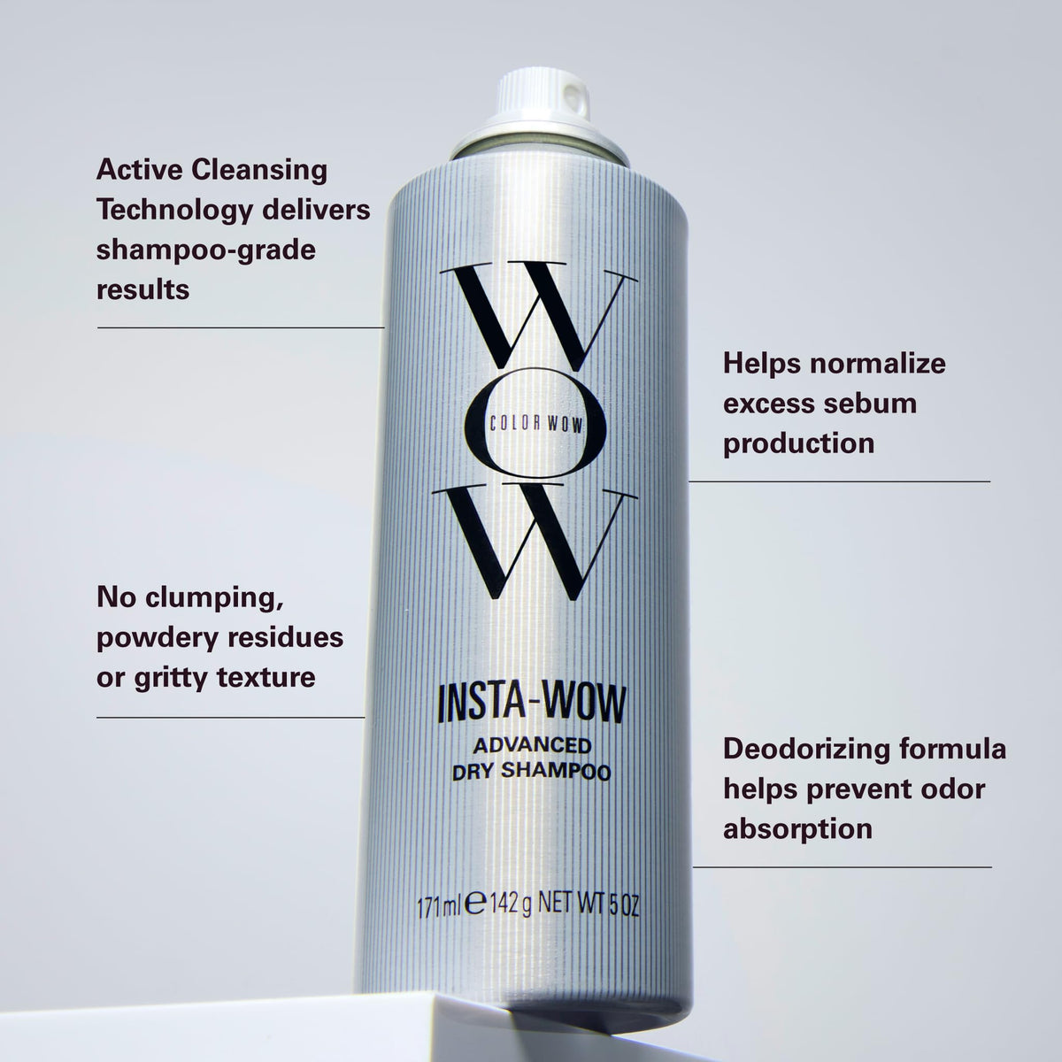 COLOR WOW applying spray to roots to absorb oil and add volume