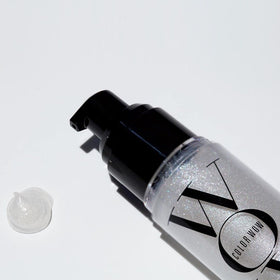 COLOR WOW bottle in hand showing product size and travel-friendly benefit