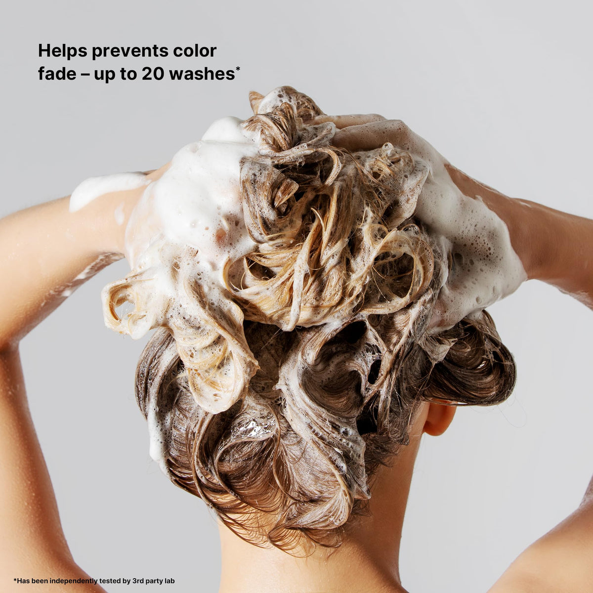 COLOR WOW shampoo pouring into hand demonstrating easy application