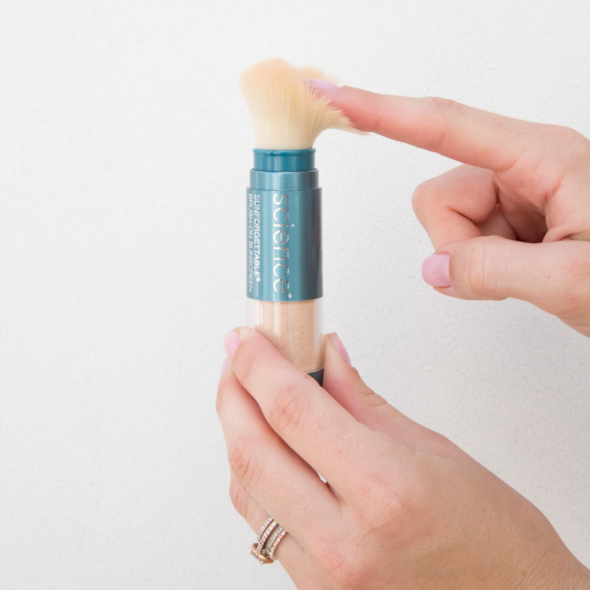 Colorescience brush-on brush and powder close-up demonstrating soft bristles and easy application