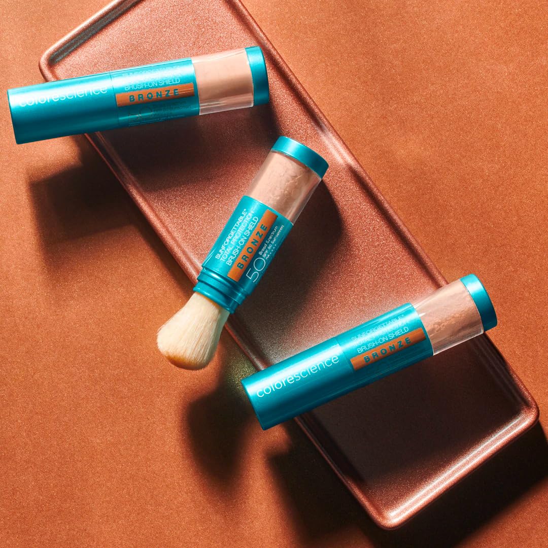 Colorescience brush-on shield bronze swatch on skin illustrating warm sun-kissed finish