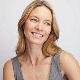 Colorescience brush-on sunscreen applied over makeup demonstrating quick touch-up and non-disruptive finish