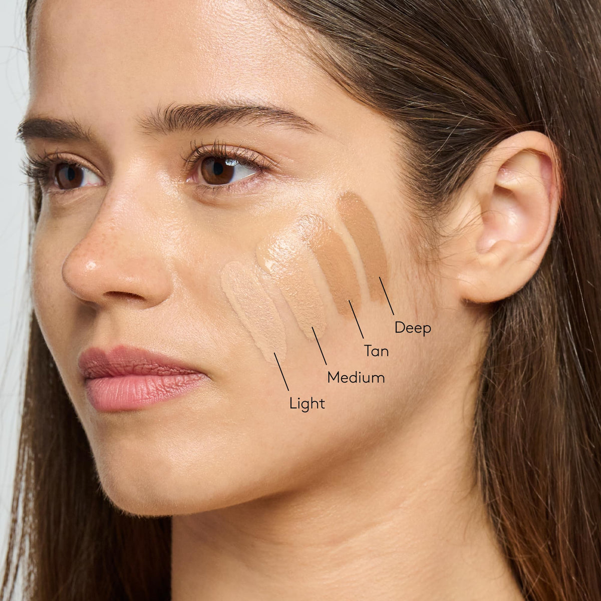 Colorescience swatches on wrist showing how Face Shield Flex adapts to undertones