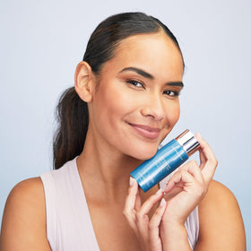 Colorescience product on hand for scale showing 1.8 fl oz portable size