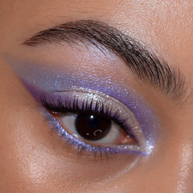 ColourPop palette in use on model eye for bold purple makeup and long-wearing intensity