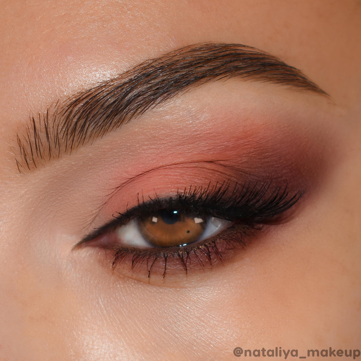 ColourPop palette being applied with a brush demonstrating method for vivid lid color