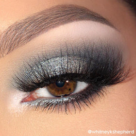 Model applying ColourPop shadow to lid demonstrating easy layering and payoff