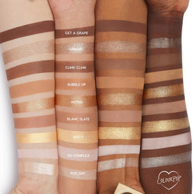ColourPop swatches on arm demonstrating high-pigment browns and shimmering golds