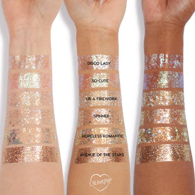 ColourPop glitter swatch on collarbone demonstrating vibrant multi-dimensional sparkle and long-lasting wear