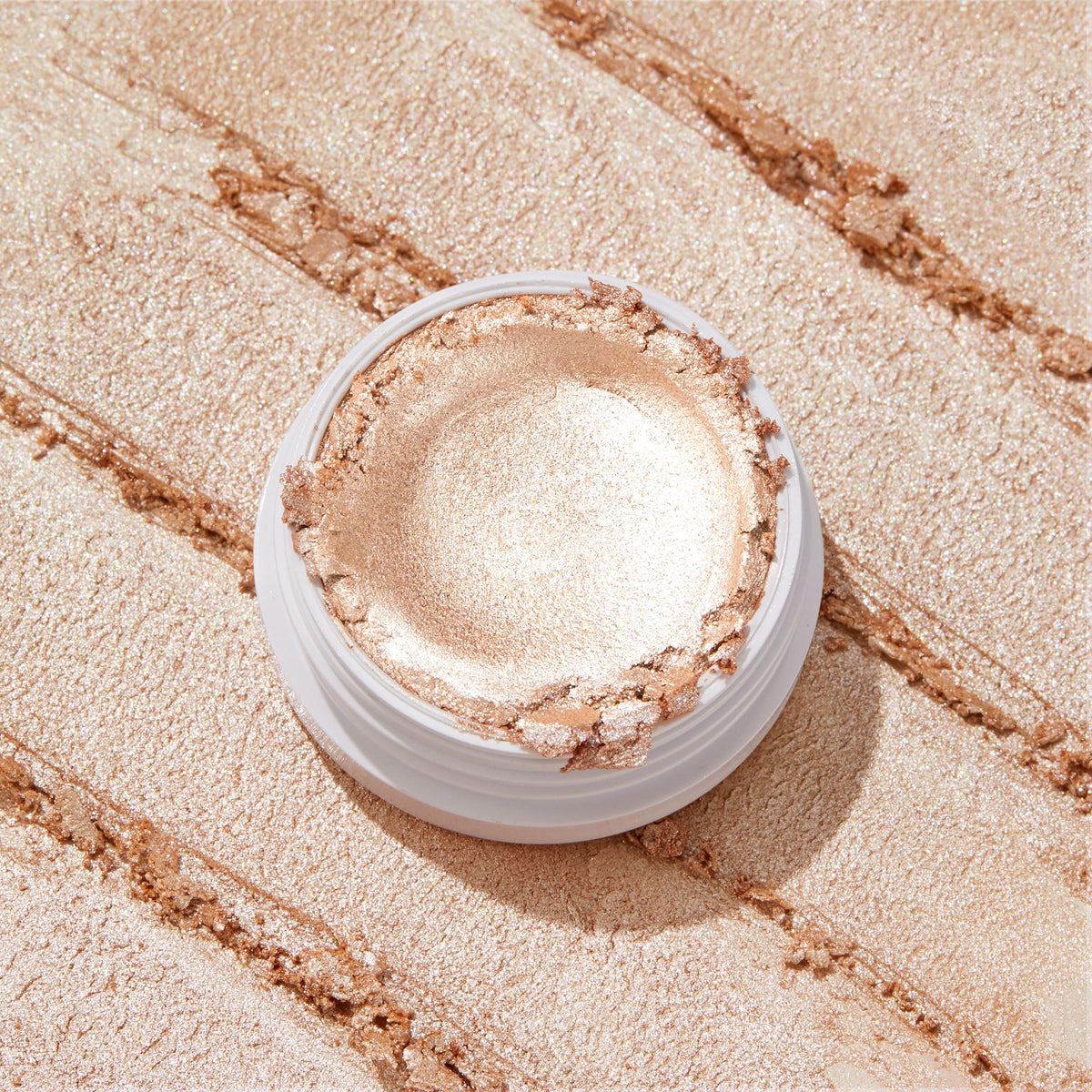 ColourPop highlighter in use on cheek highlighting natural radiance and seamless application