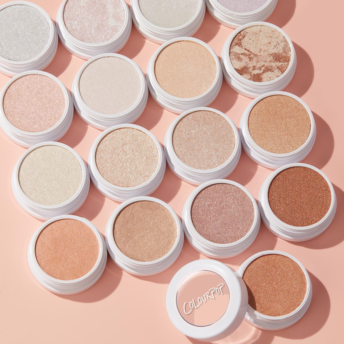 ColourPop highlighter packaging on vanity lifestyle shot conveying everyday use and trendy presentation