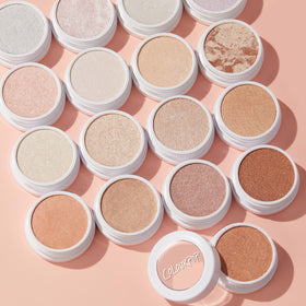 ColourPop highlighter packaging on vanity lifestyle shot conveying everyday use and trendy presentation