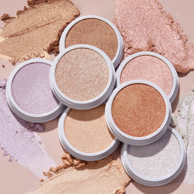 ColourPop highlighter held in hand showing 0.15 oz compact size and travel-ready convenience