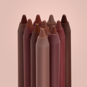 ColourPop Lippie Pencil held in hand for size comparison showing travel-friendly portability