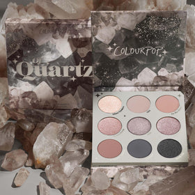 ColourPop Of Quartz held in hand to show compact 0.3 oz size and travel convenience
