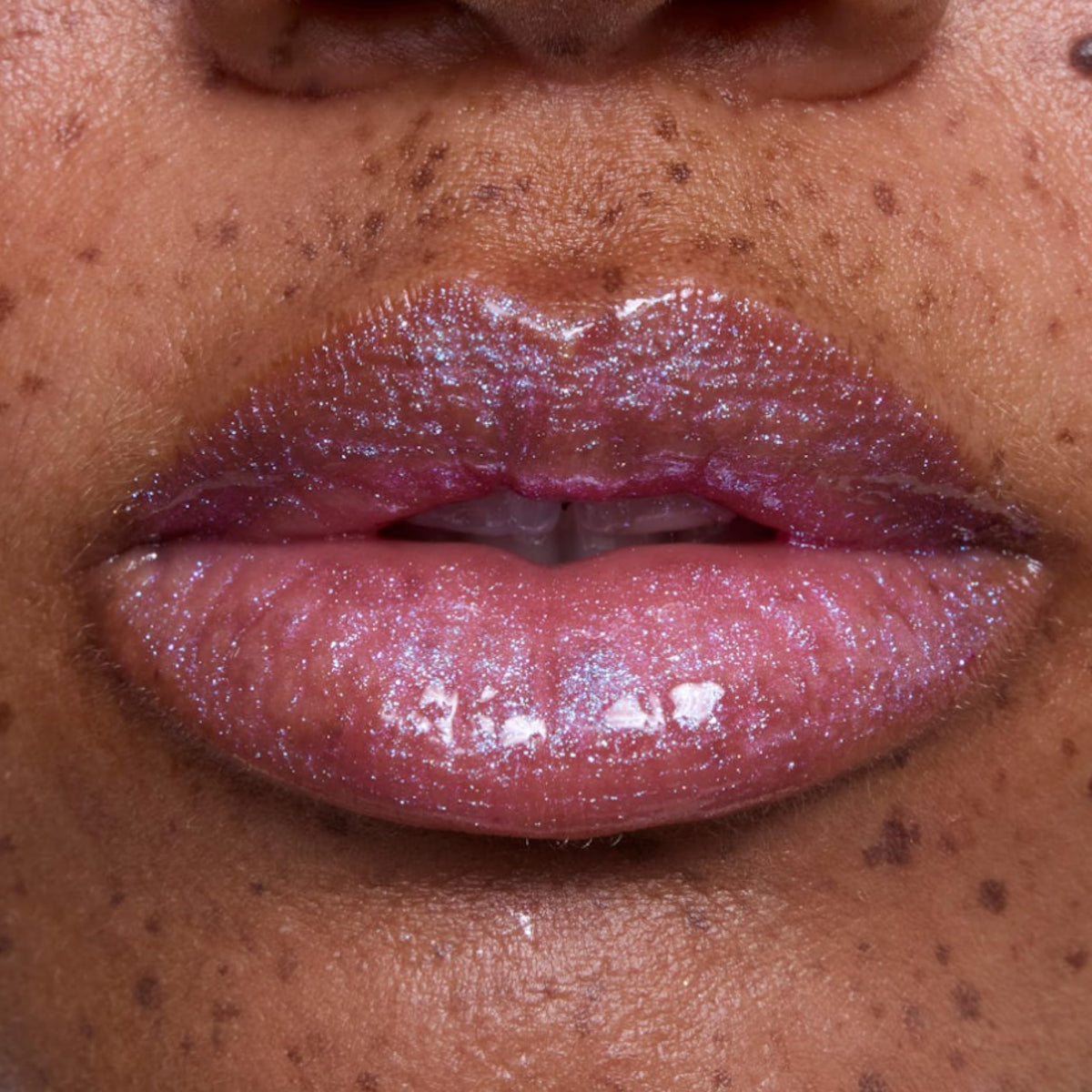 ColourPop gloss on lips in Rapunzel-inspired look showing luminous, non-sticky shine