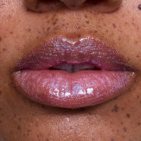 ColourPop gloss on lips in Rapunzel-inspired look showing luminous, non-sticky shine