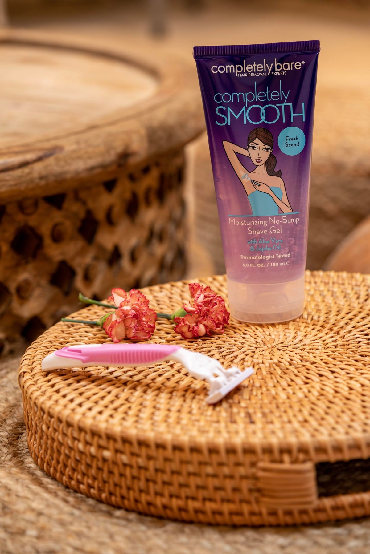 Completely Bare bottle held in hand illustrating 6 fl oz size and travel convenience