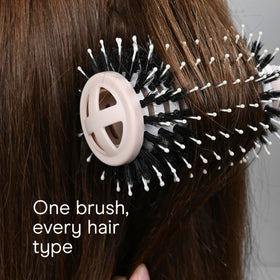 Conair brush in hand for size scale and easy maneuvering during blowouts