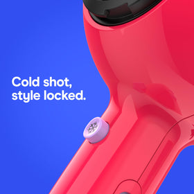Conair Cake Pop held in hand demonstrating compact travel-friendly size