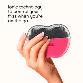 Conair CR80 held in hand to show size and effortless portability for touch-ups