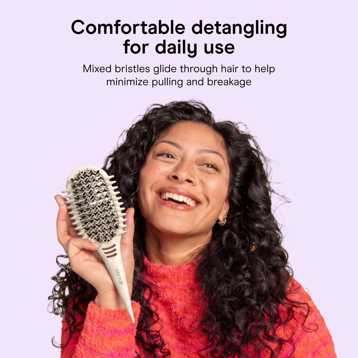 Conair Curl Define Pro held in hand to demonstrate size and travel-friendly scale