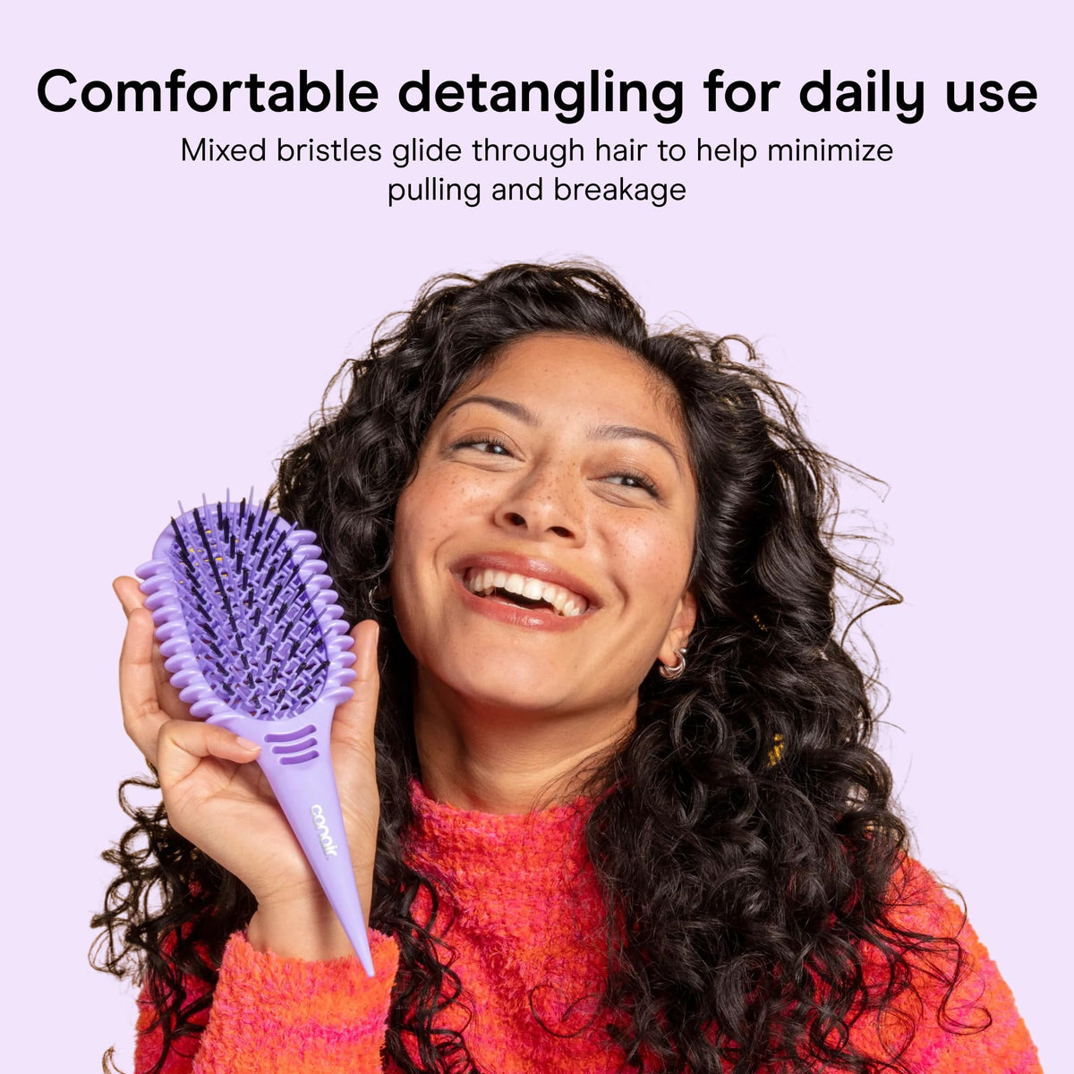 Conair built-in sectioning handle separating hair for precise styling control